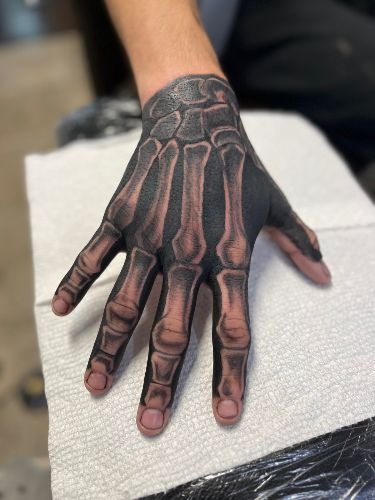 Hyper-Realistic Bone Carving Tattoo Design
