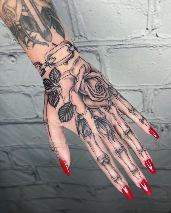 Rose and Chainbone Elegance Tattoo Design