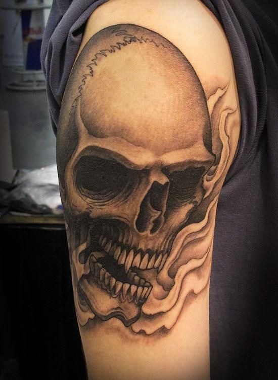 Vibrant Red and Black Skull Shoulder Tattoo Tattoo Design