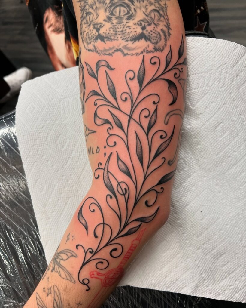 Flowing Vine Filler with Elegant Leafwork Tattoo Design