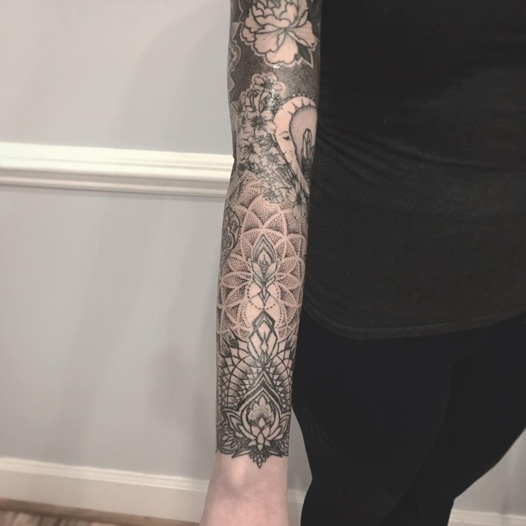 Ornamental Dotwork Sleeve Filler with Lotus and Mandala Flow Tattoo Design