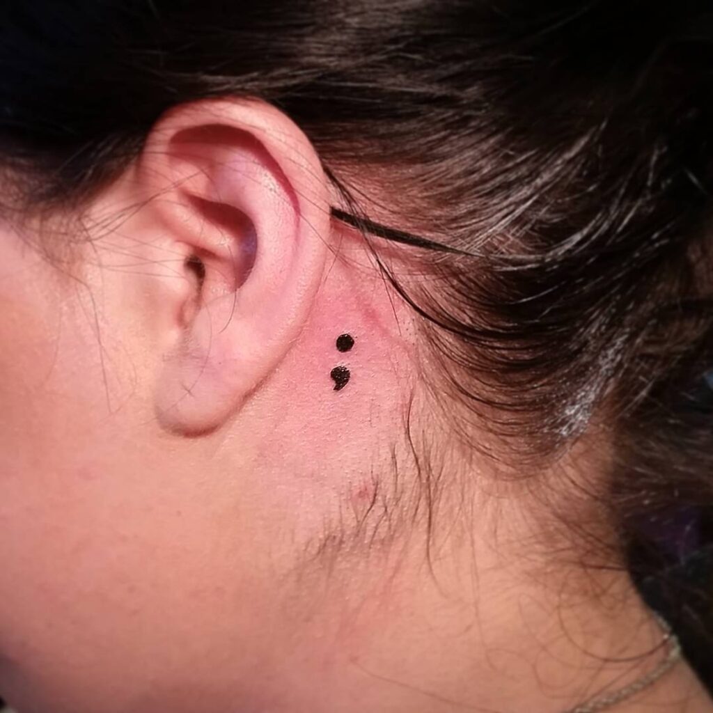 Minimal Semicolon Behind the Ear Tattoo Design