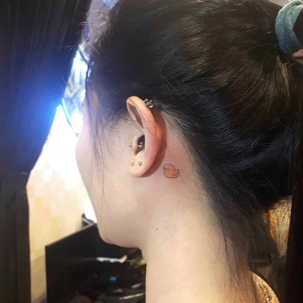 Playful Rubber Duck Behind Ear Tattoo Tattoo Design