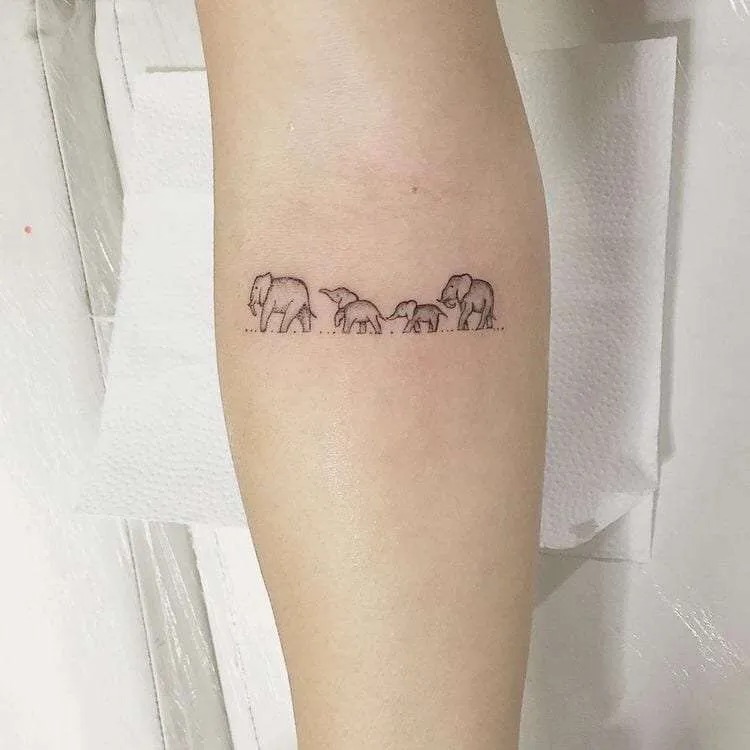 For those who feel a strong connection to family or have multiple pets, this tattoo of elephants walking in a line evokes a sense of unity and loyalty.