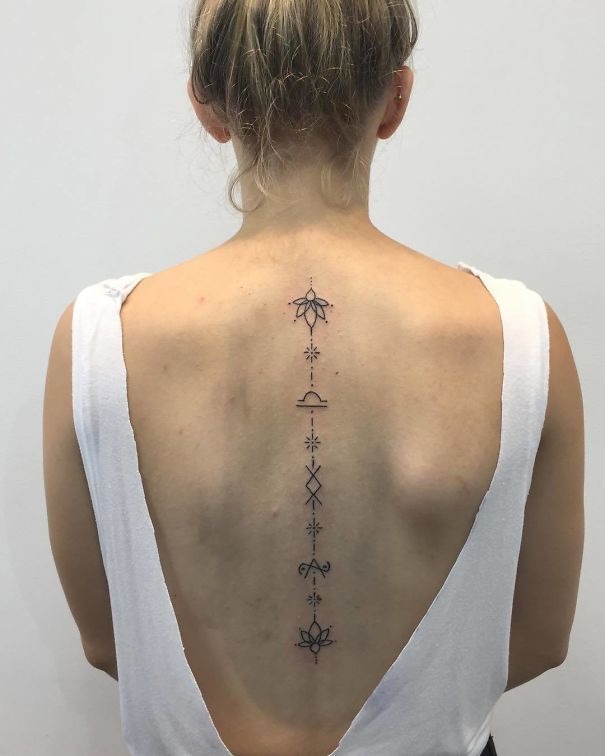 Elegant Floral Backpiece Tattoo Design