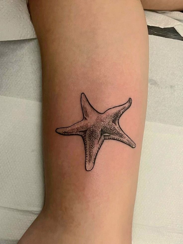 Detailed Arm Starfish Tattoo with Ocean Texture Tattoo Design