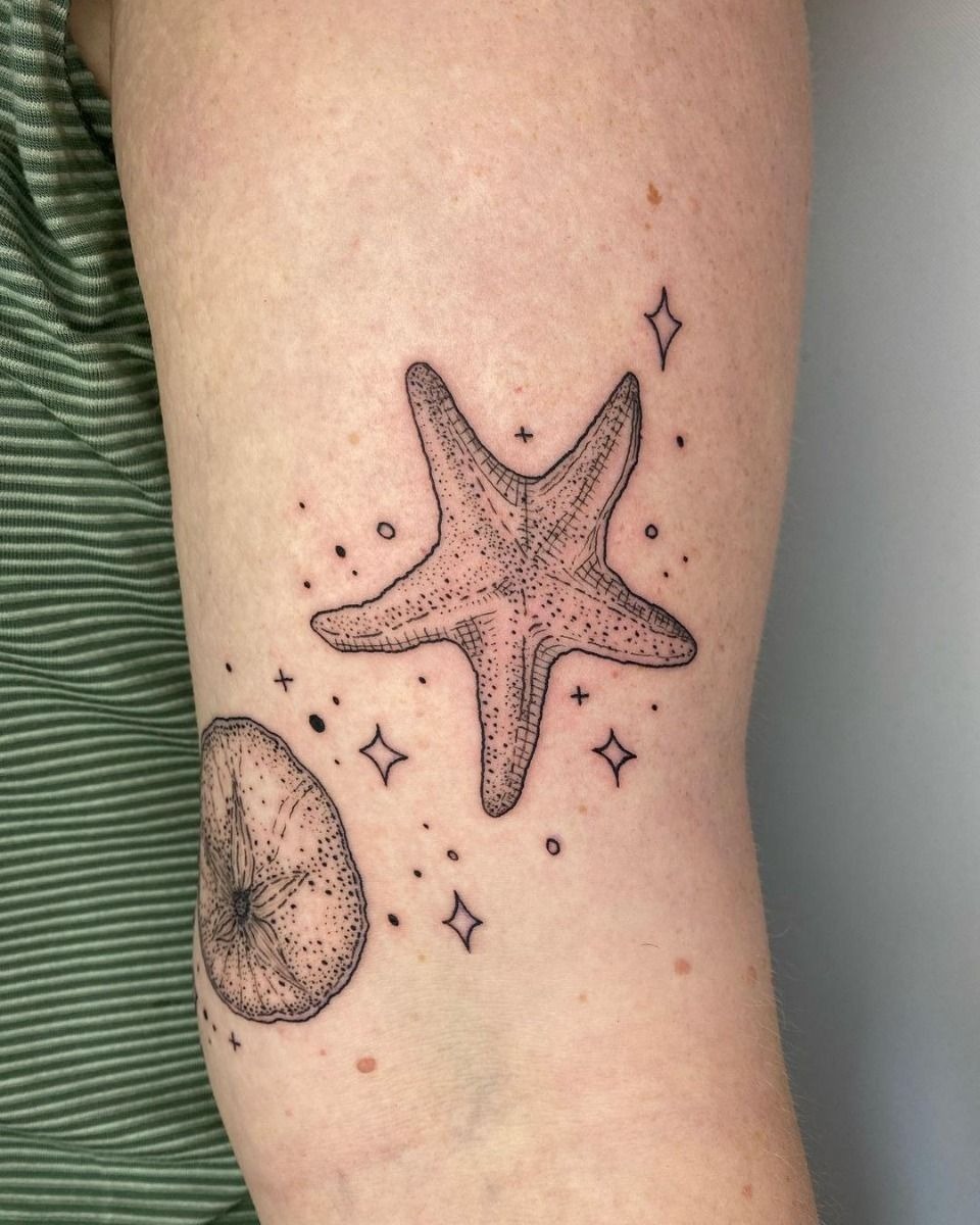 Fine Line Starfish with Celestial Details Tattoo Design