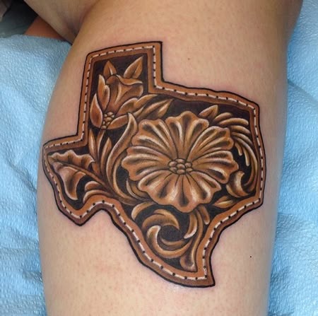 This one is such a gorgeous nod to Western craft, like a piece of tooled leather you'd find on a favorite belt or saddle, turned into art you carry forever.