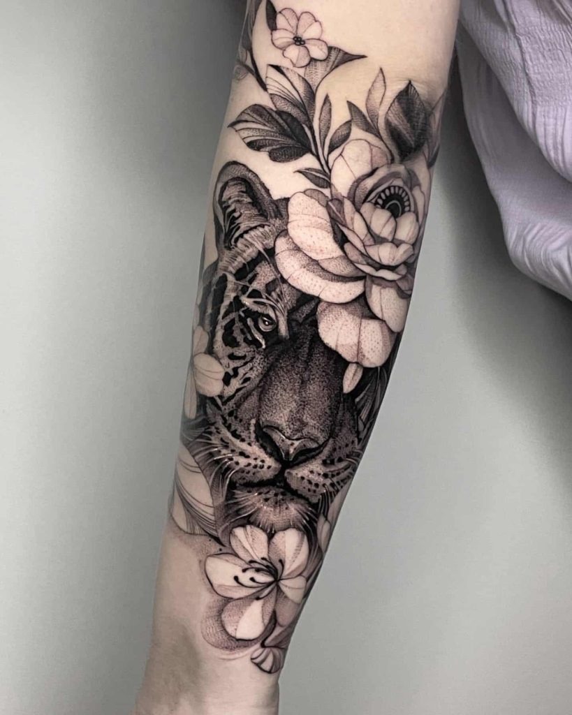 Realistic Tiger Amidst Flowers Tattoo Design