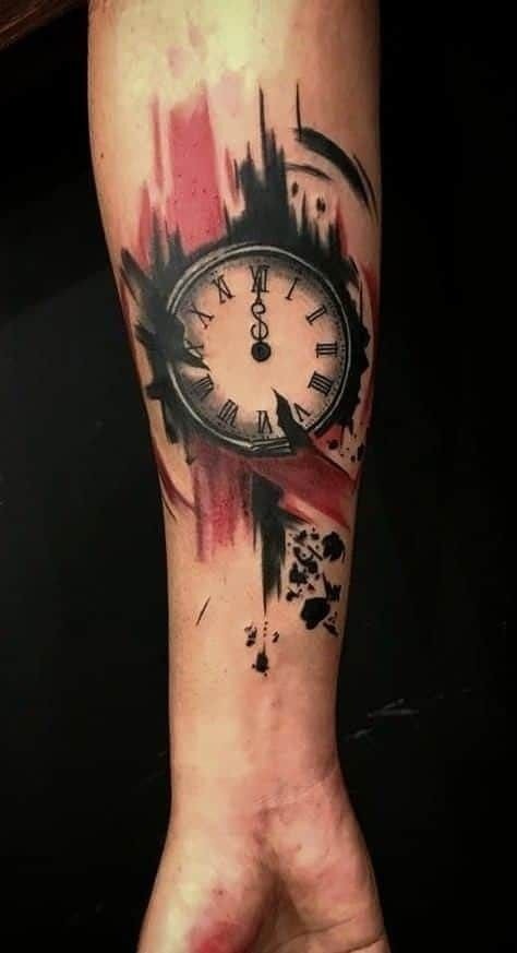 This artistic tattoo combines the boldness of Roman numerals with the softness of watercolor strokes.