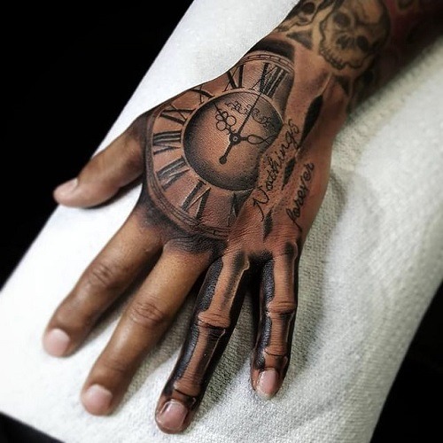 A bold tattoo placed on the hand, featuring a detailed clock design with Roman numerals.