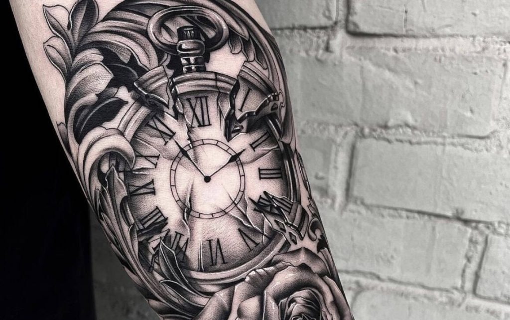 This tattoo artfully blends a classic pocket watch with intricate floral elements, creating a design that exudes timeless elegance.