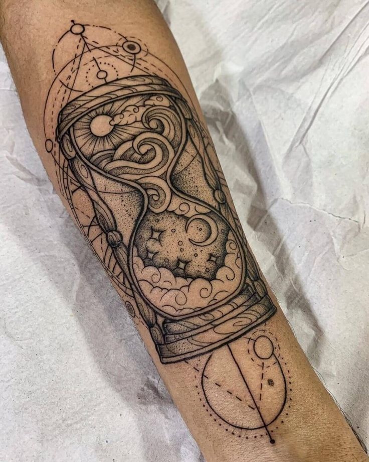 A mesmerizing tattoo of an hourglass filled with celestial imagery, including stars and swirling galaxies.