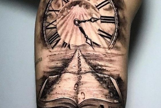 This unique tattoo combines an open book with a clock and a pathway leading into the horizon.