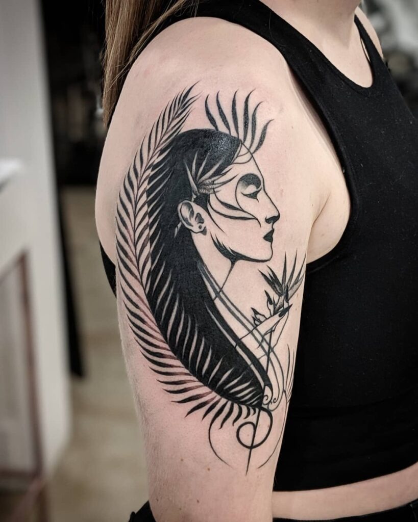 Abstract Portrait with Botanical Elements Upper Arm Tattoo Tattoo Design