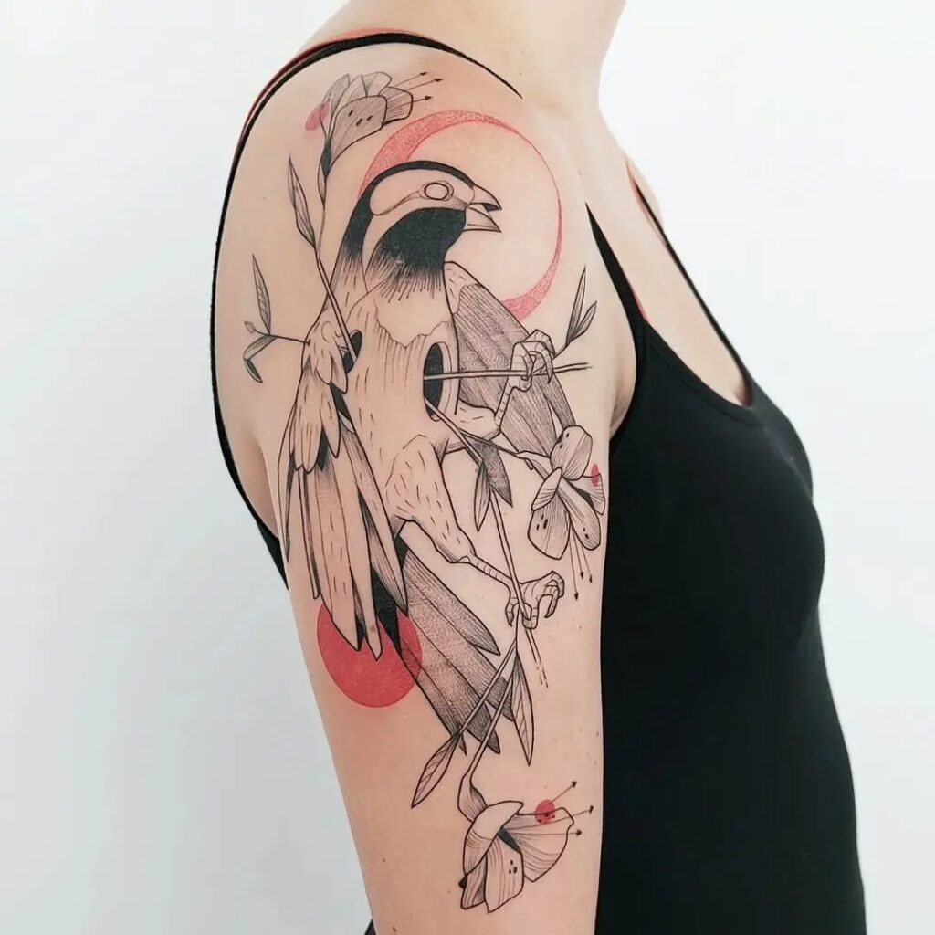 Artistic Bird and Botanical Upper Arm Tattoo Tattoo Design