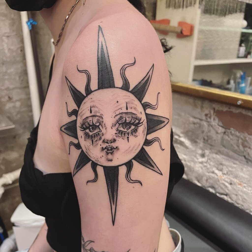 Bold Sun with Whimsical Face Upper Arm Tattoo Tattoo Design