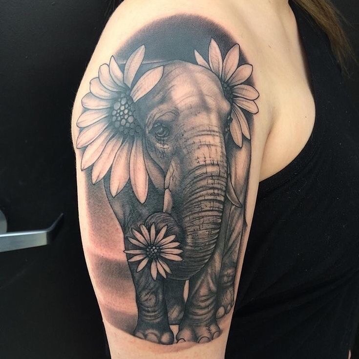 Gentle Elephant and Daisy Upper Arm Tattoo Tattoo Design