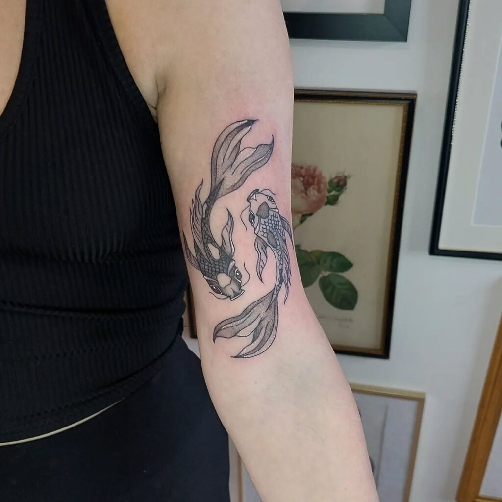 Graceful Koi Fish Upper Arm Tattoo Tattoo Design