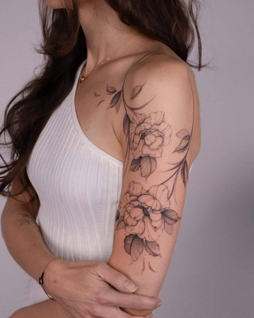 Graceful Peony and Leaf Vine Upper Arm Tattoo Tattoo Design