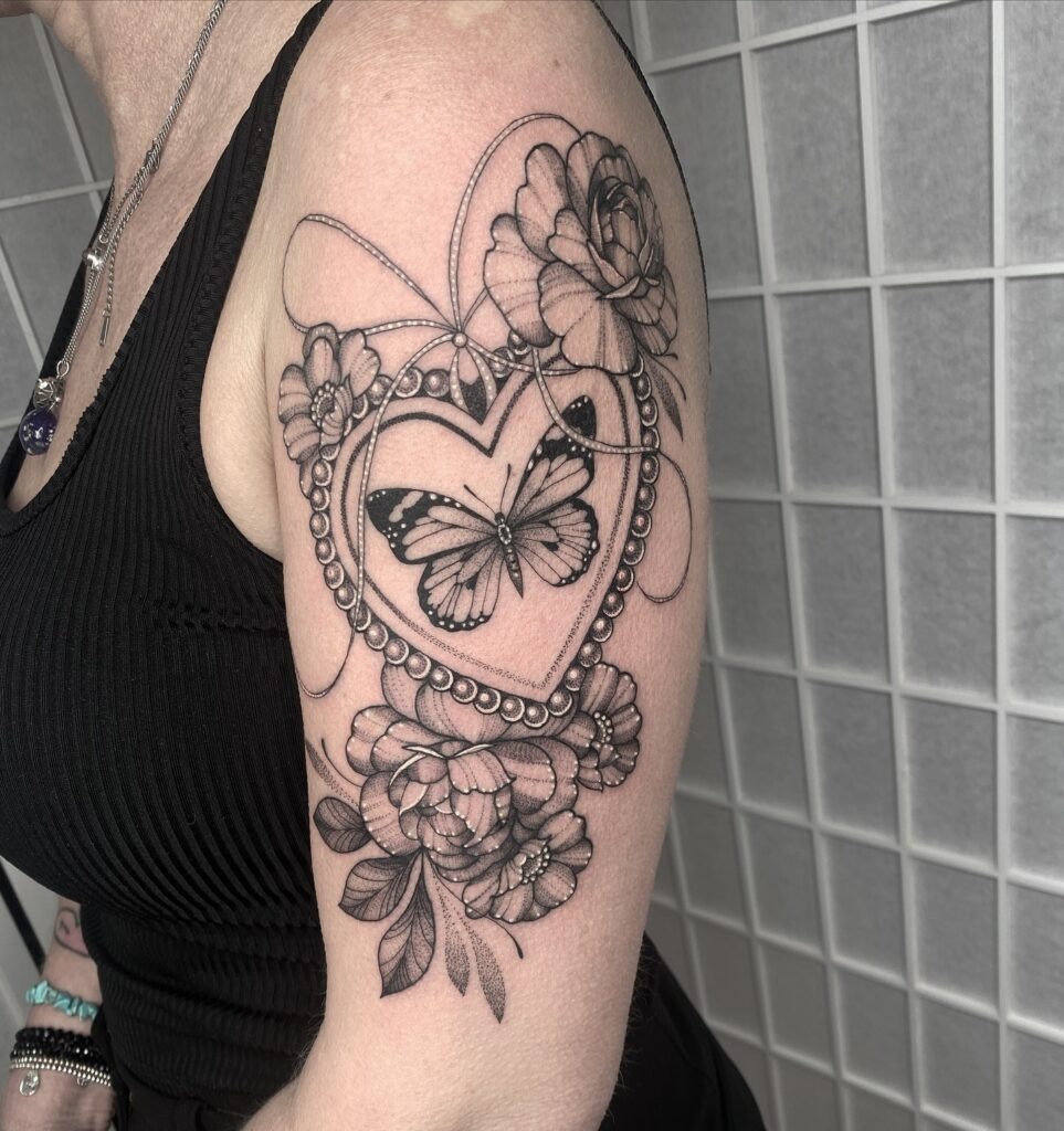 Heart Locket with Butterfly and Flowers Upper Arm Tattoo Tattoo Design