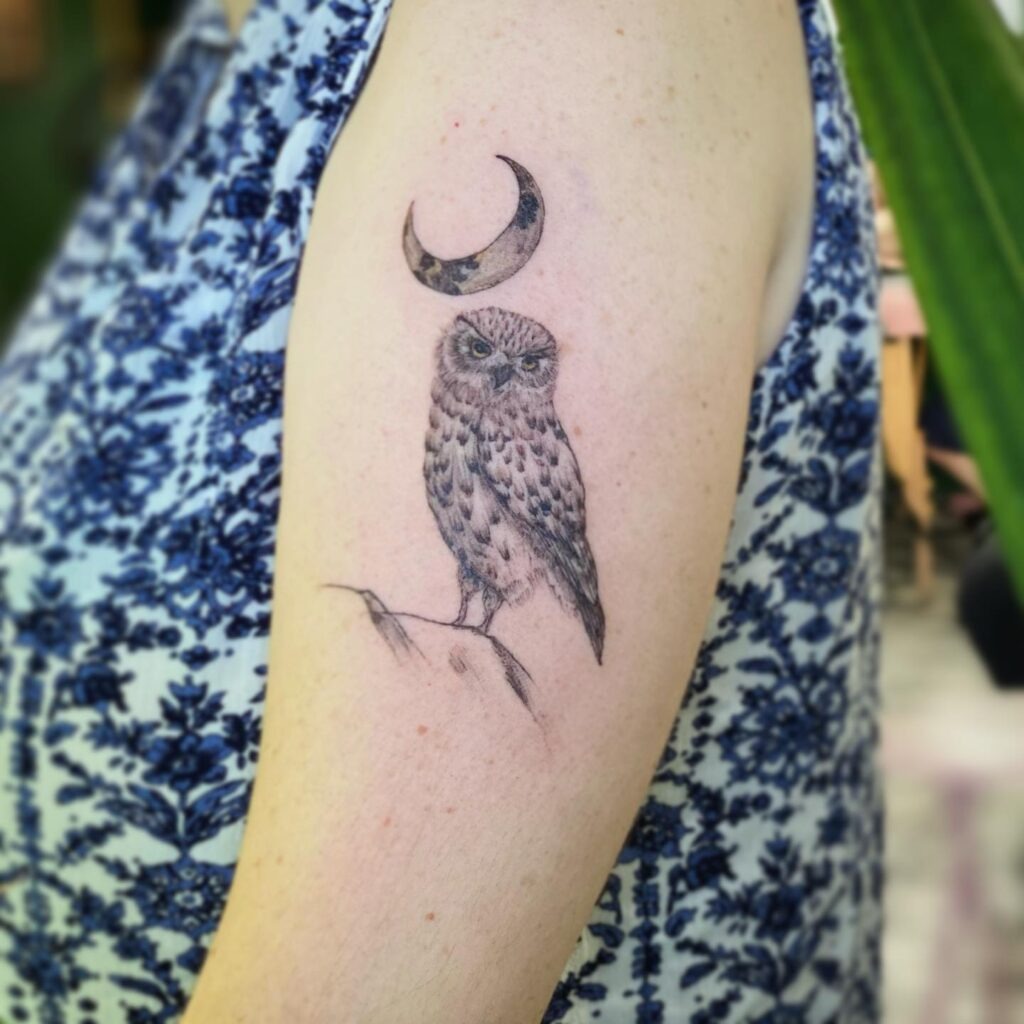 Owl Perched Beneath a Crescent Moon Upper Arm Tattoo Tattoo Design