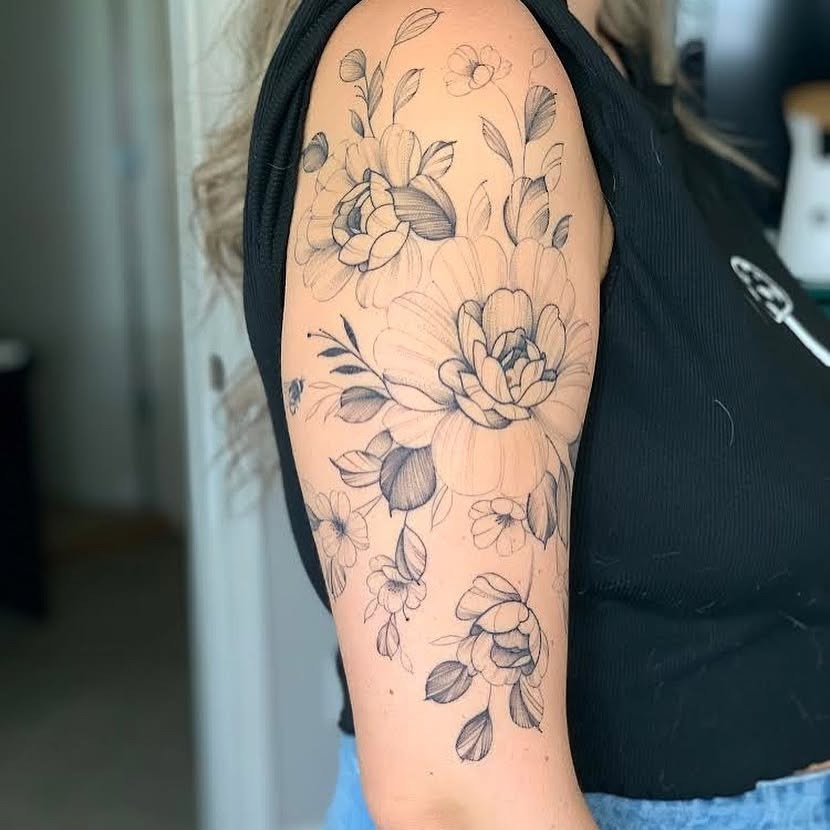 Soft Black-and-Gray Floral Upper Arm Tattoo Tattoo Design