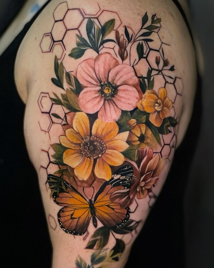 Vibrant Floral and Butterfly Upper Arm Tattoo Tattoo Design