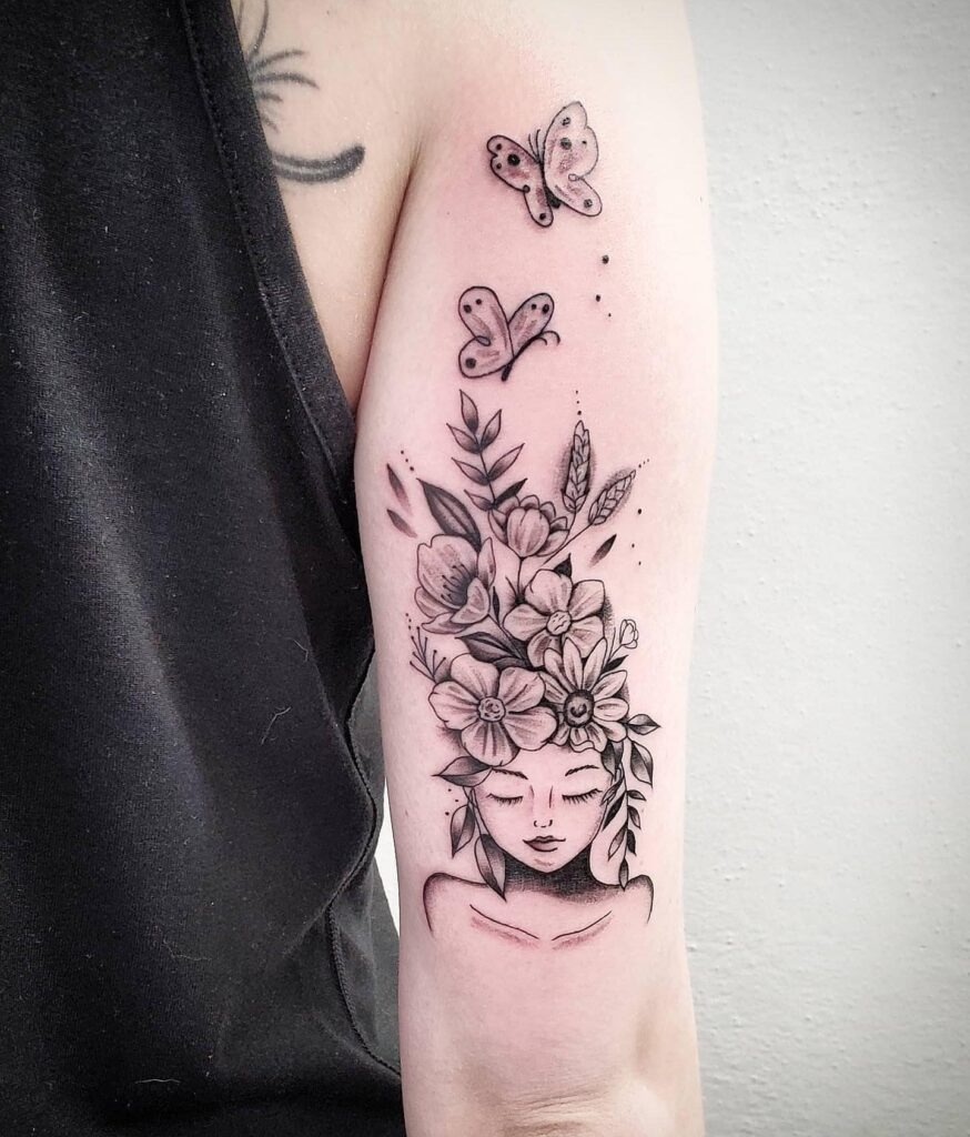 Woman with Floral Hair and Butterflies Tattoo Tattoo Design