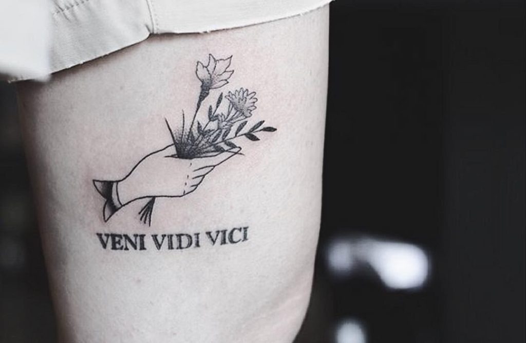 Delicate Arm Tattoo with Floral Elements Tattoo Design