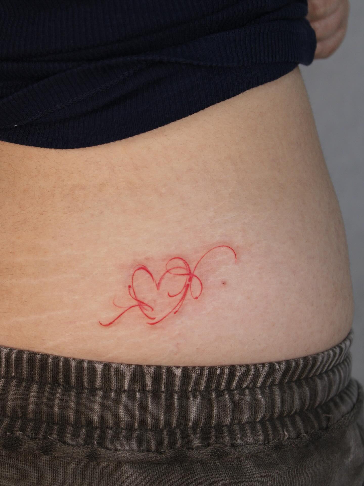 Scar-Covering Blossom Waist Tattoo Tattoo Design