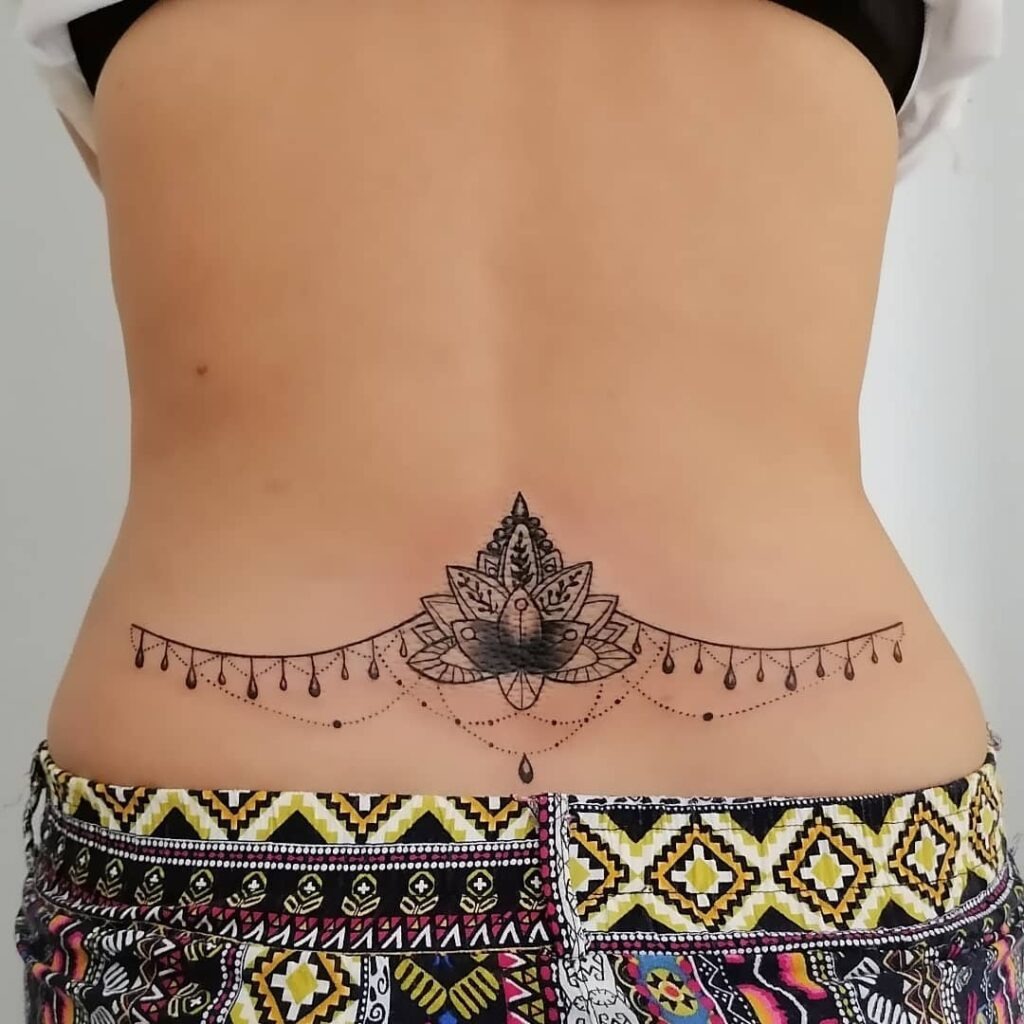 Sleeping Cat with Cosmic Elements Waist Tattoo Tattoo Design