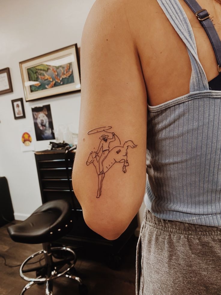 Minimalist Cowboy on a Bucking Horse Tattoo Design