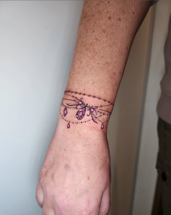 Bejeweled Bracelet Tattoo with Pink Gems Tattoo Design