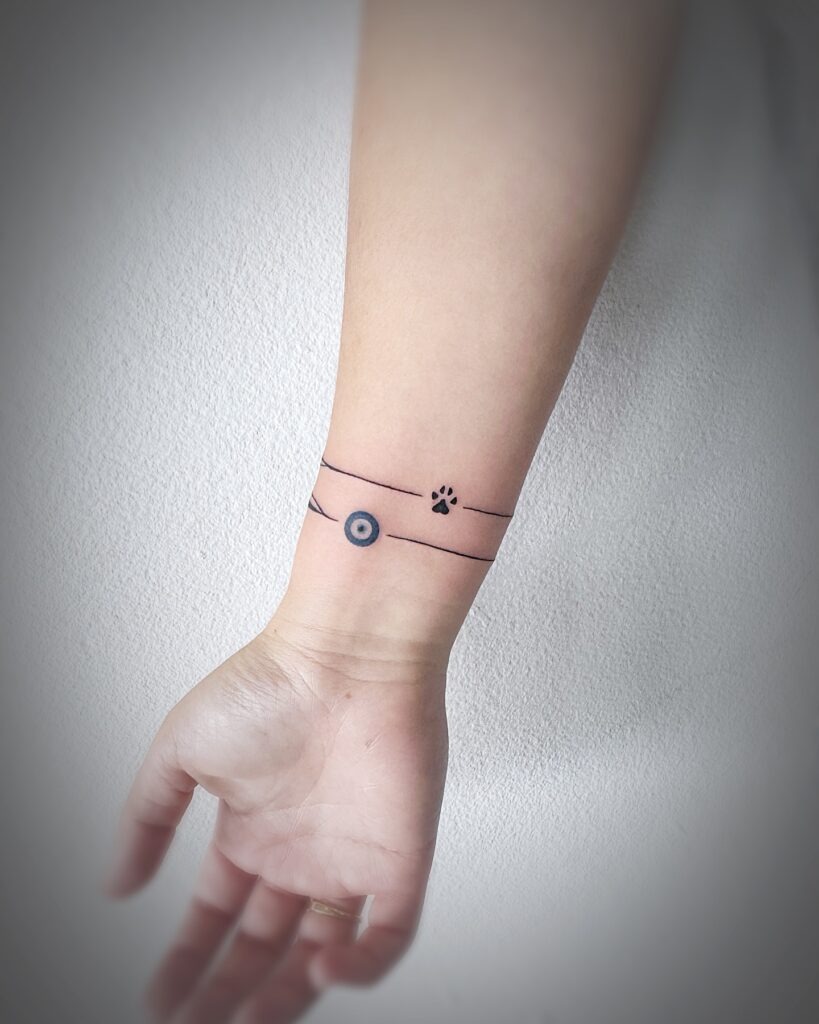Evil Eye and Paw Charm Bracelet Tattoo Tattoo Design