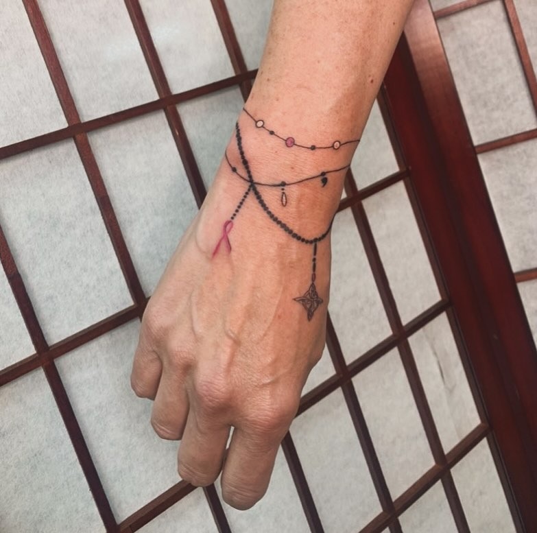 Layered Symbolic Bracelet Tattoo Tattoo Design