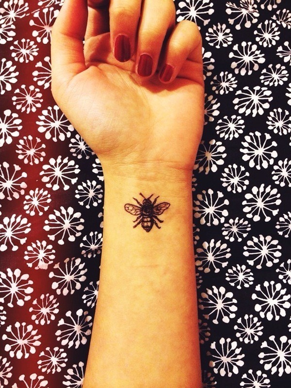 A beautiful bee wrist tattoo Tattoo Design