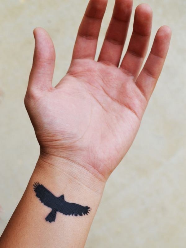 A big black Bird Wrist Tattoo Tattoo Design
