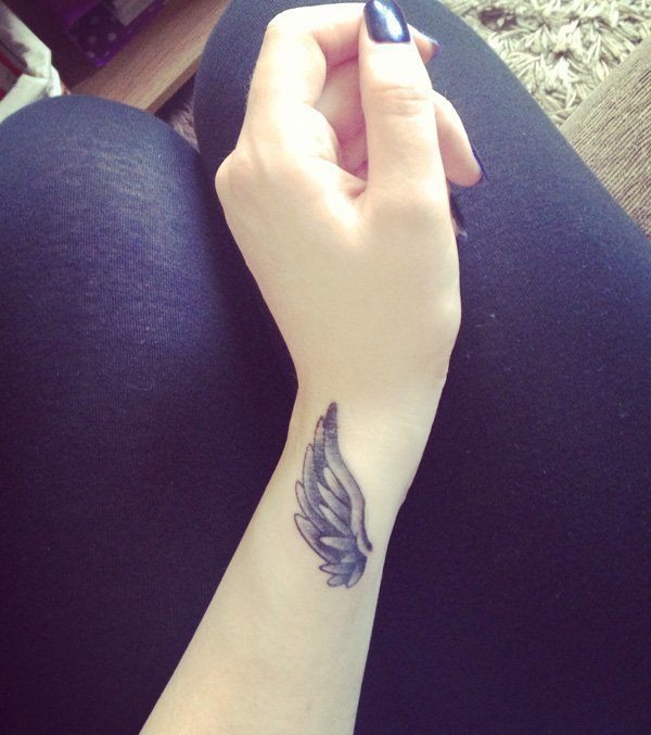 Angel’s Wing wrist Tattoo on a lady’s arm Tattoo Design