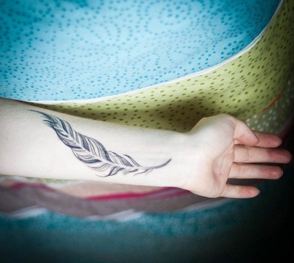 Contours feather wrist tattoo Tattoo Design