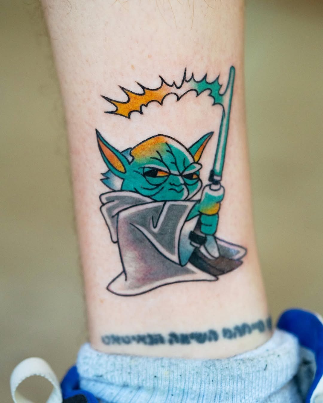 Adorable Baby Yoda in a unique tattoo design Tattoo Design