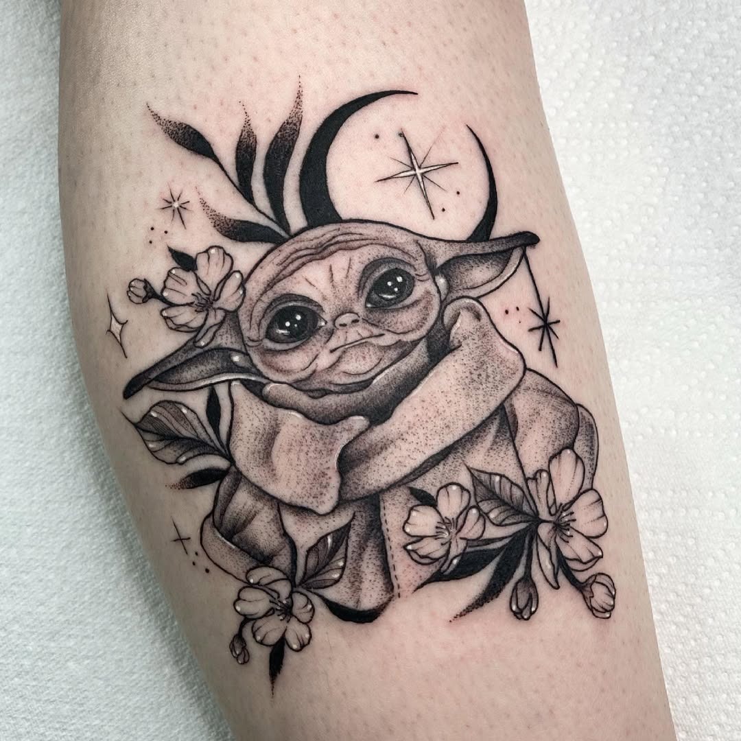 Charming Yoda Tattoo with Cosmic Elements Tattoo Design