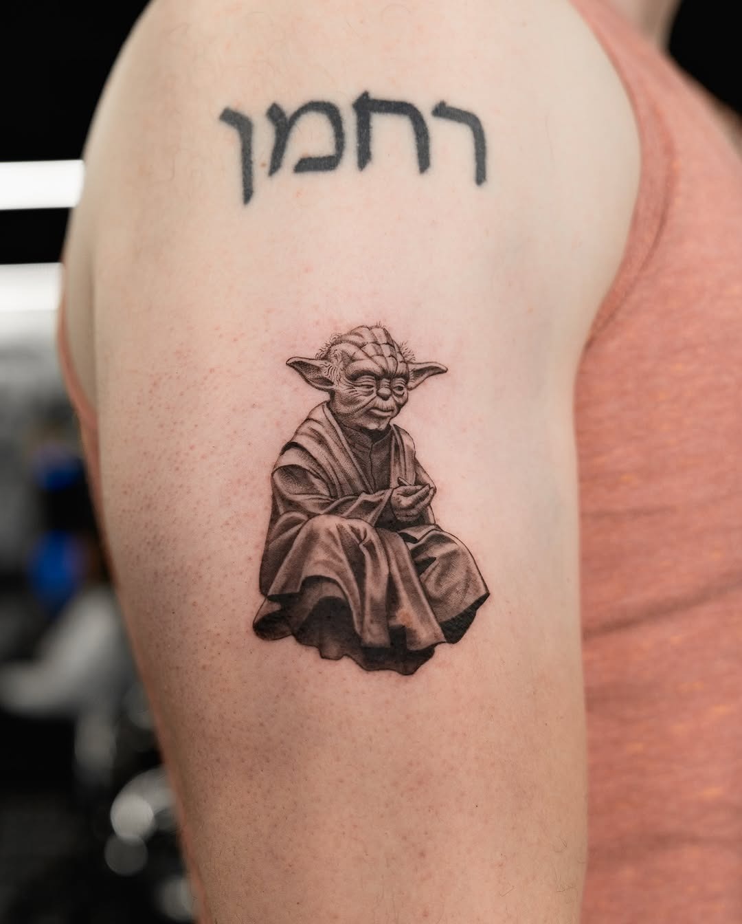 Intricate Yoda Tattoo Holding a Lightsaber Tattoo Design