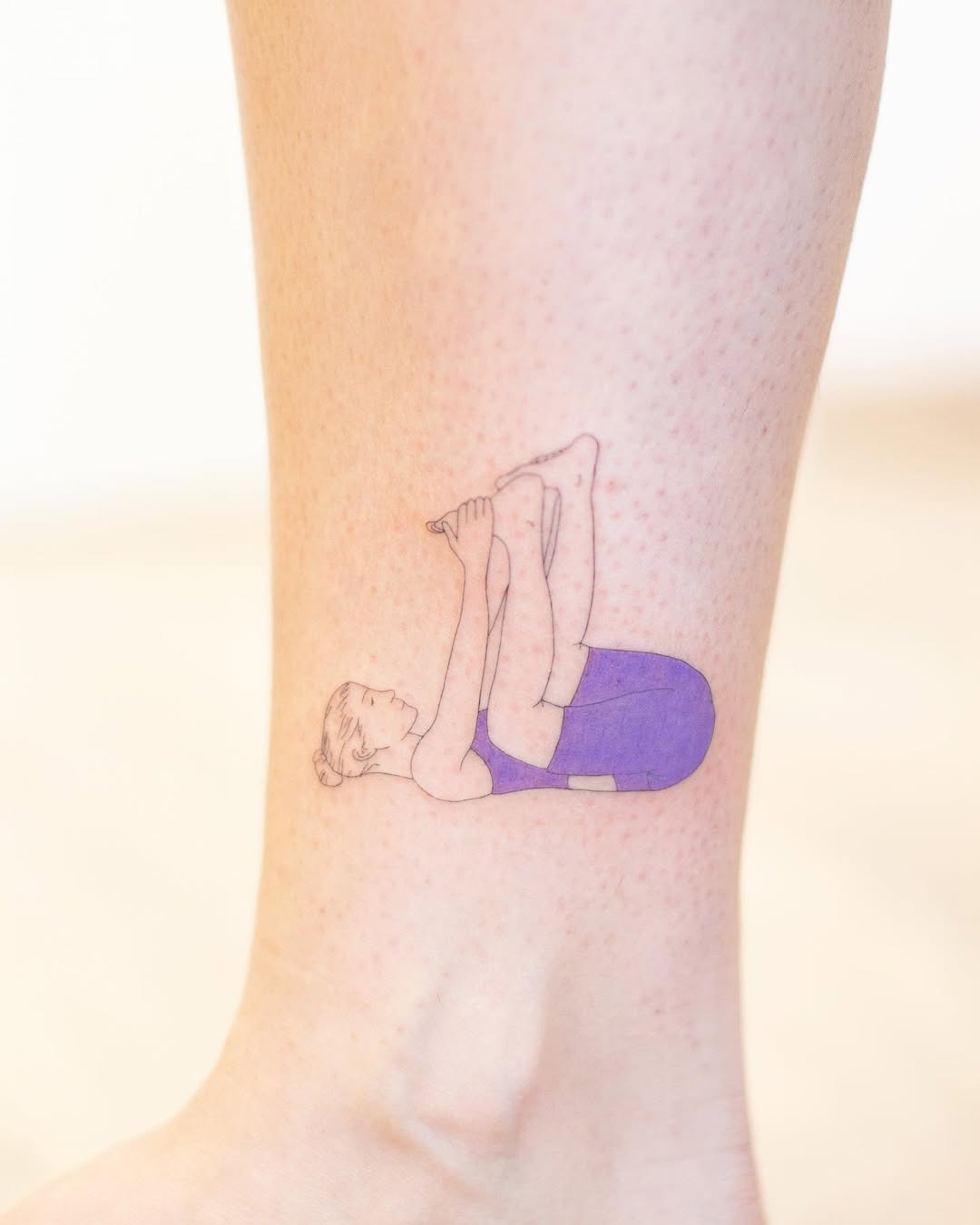 Elegant sun tattoo adorning the ankle Tattoo Design