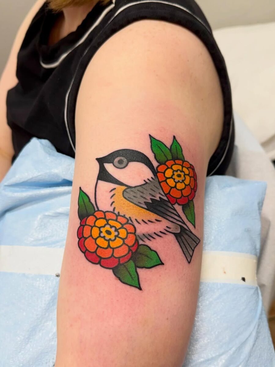 Bright Zinnia Tattoo with a Charming Bird Tattoo Design