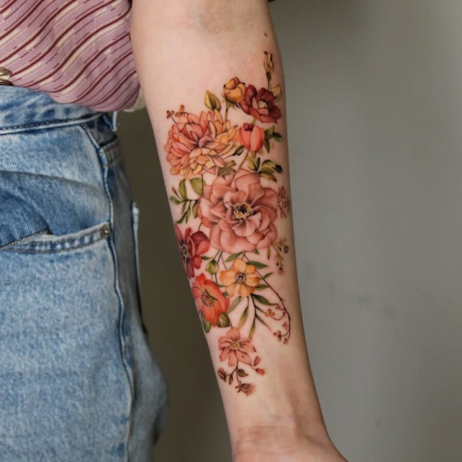 Elegant floral zinnia tattoo on forearm Tattoo Design