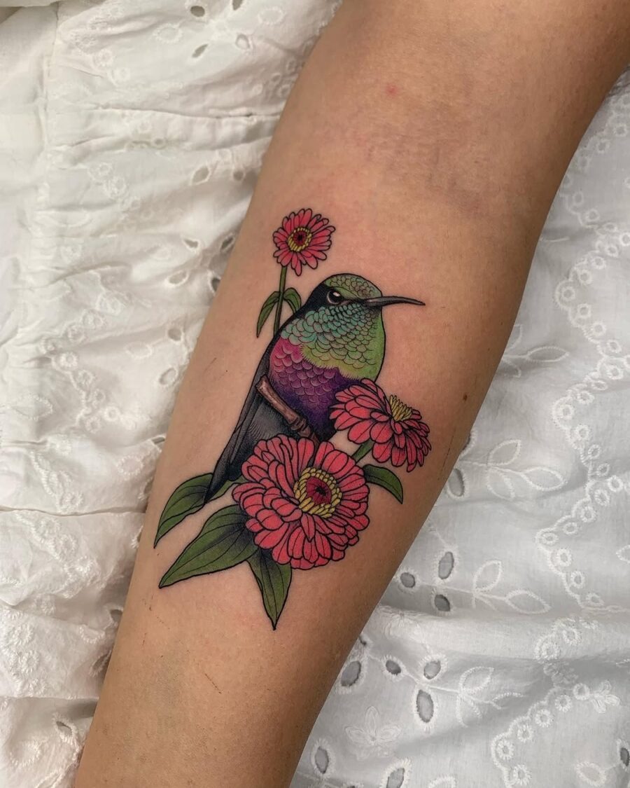 Vibrant hummingbird among beautiful zinnia flowers Tattoo Design