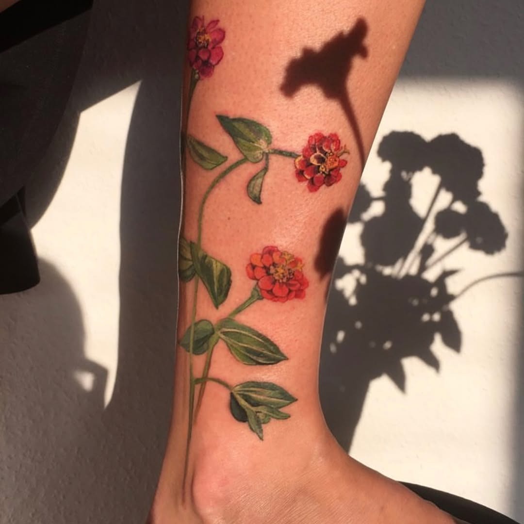Vibrant Zinnia Tattoo on the Leg Tattoo Design