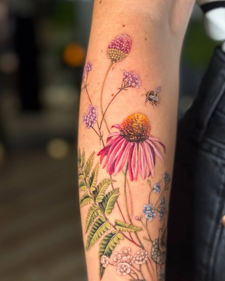 Vibrant zinnia tattoo with floral details Tattoo Design
